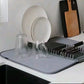 مصفاة أطباق صغيرة الحجم على شكل حصيرة Egouttoir à vaisselle compact de type tapis ou support pliable