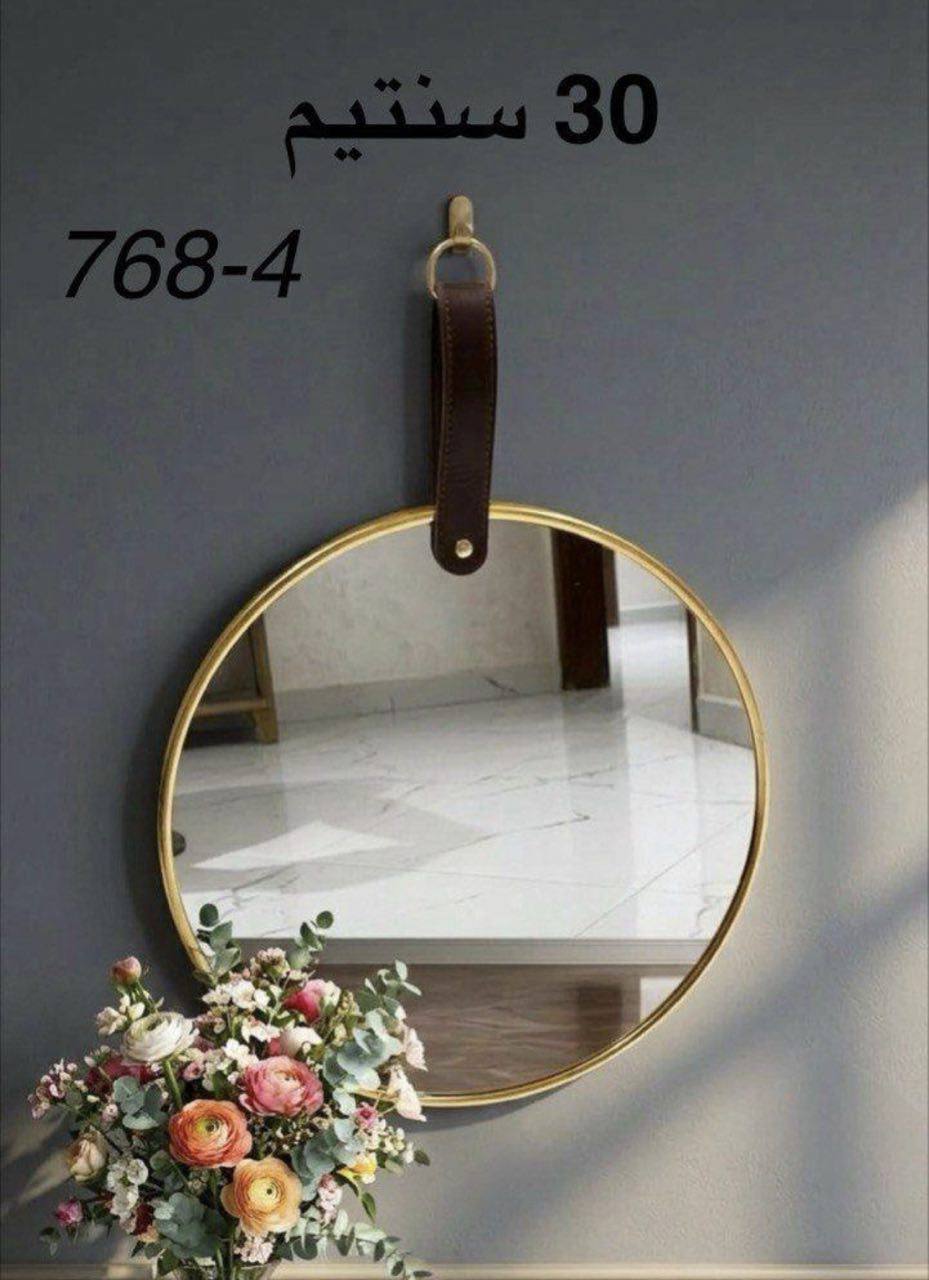 مرآة حائط دائرية بتصميم أنيق وبسيط، قطعة ديكور Miroir mural rond au design épuré et élégant pièce décorative